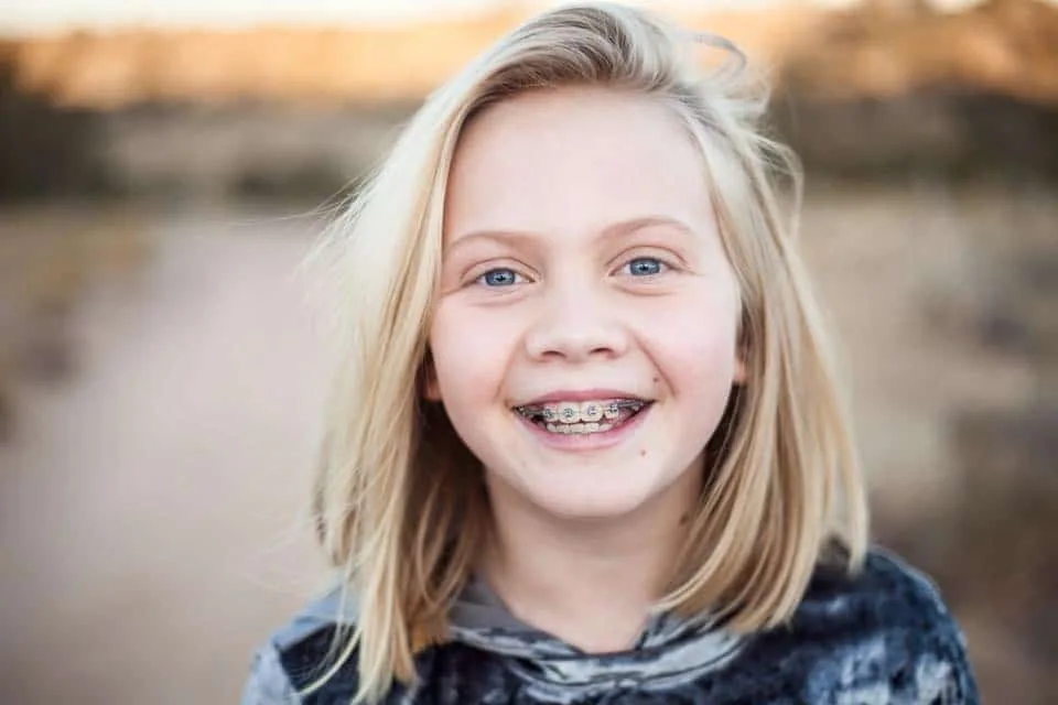 Dr. JAW patient smiling with braces